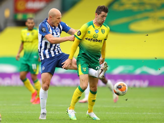 Brighton & Hove Albion's Aaron Mooy in action vies with Norwich City's Kenny McLean during their match at Carrow Road, Norwich 