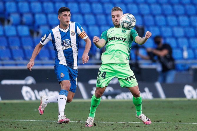 CD Leganes' Kevin Rodrigues (right) competes for the ball with RCD Espanyol's Javi Lopez