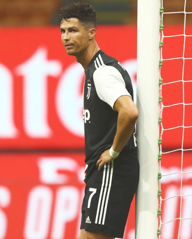 Juventus FC's Cristiano Ronaldo is dejected as AC Milan score during their during the Serie A match at Stadio Giuseppe Meazza in Milan