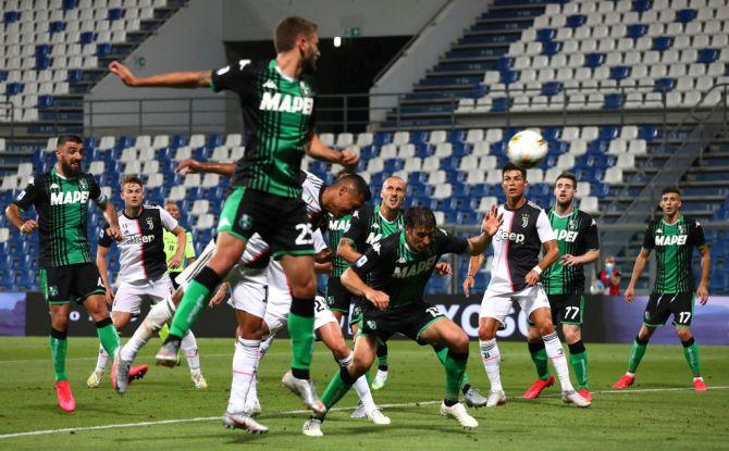 Juventus FC's Alex Sandro scores during the Serie A match between US Sassuolo and Juventus at Mapei Stadium - Citta del Tricolore in Reggio nell'Emilia, Italy on Wednesday