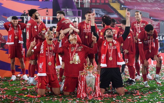 Liverpool's Brazilian trio Alisson, Firmino and Fabinho thank the almighty in celebration 