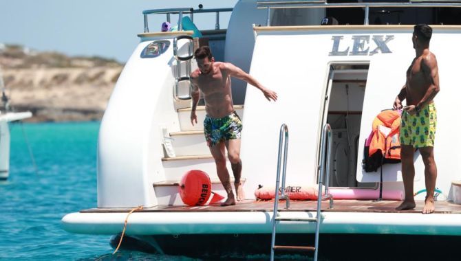 Lionel Messi dives into the ocean
