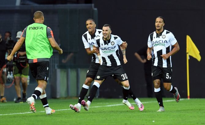 Udinese's Ilija Nestorovski celebrates with teammates after scoring their first goal agains Juventus in their Serie A match at Dacia Arena, Udine, Italy, on Thursday