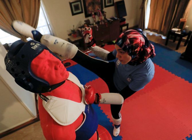 Hedaya Malak Wahba, Egyptian Taekwondo practitioner and 2016 Rio Olympics bronze medallist, works out at her home as she trains in Cairo, Egypt, for the postponed Tokyo Olympic Games amid the spread of the coronavirus disease (COVID-19). 