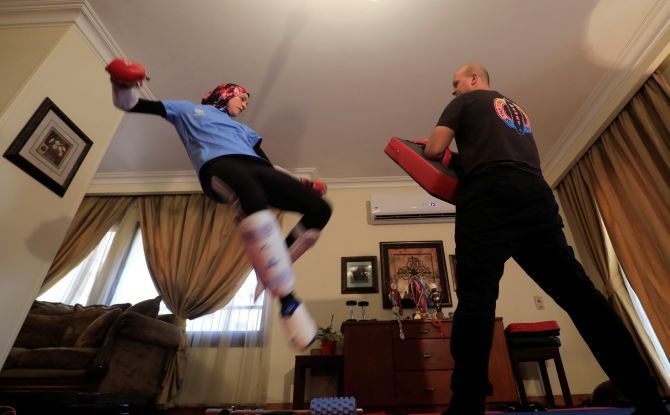 Since the new coronavirus outbreak her training partners at her Cairo apartment are her brother -- who also practises taekwondo -- and a human-shaped kicking pad donated by a sponsor.