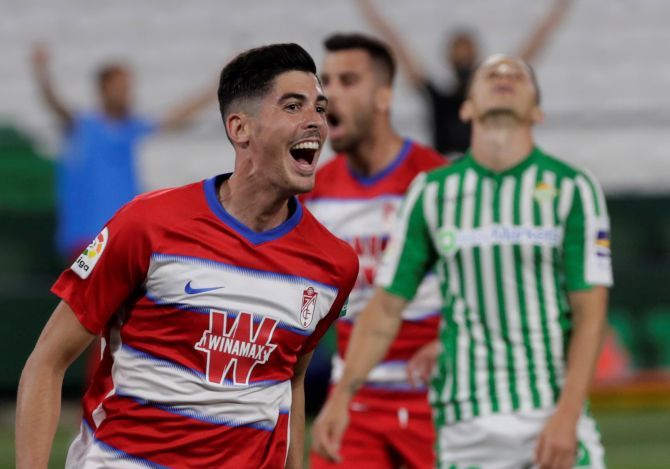 Granada CF's Carlos Fernandez celebrates after scoring the opening goal against Real Betis on Monday