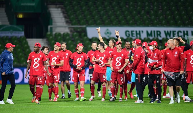 Bayern Munich players celebrate winning their Bundesliga title after defeating Werder Bremen at Weser-Stadion, in Bremen, Germany, on Tuesday