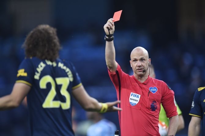 Arsenal's David Luiz is shown a red card by referee Anthony Taylor