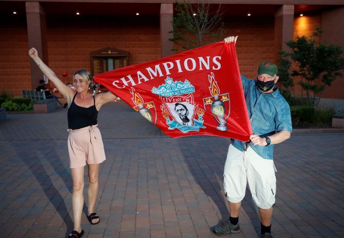 Fans celebrating Liverpool FC winning the Premier League title 