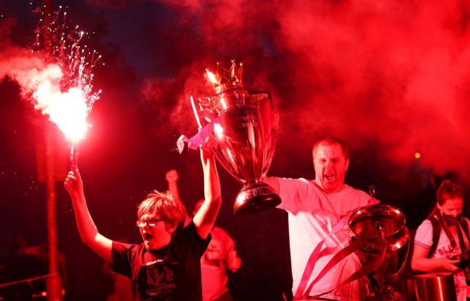 iverpool fans celebrate as their team clinch the Premier League title on June 25, 2020 in Liverpool, England.