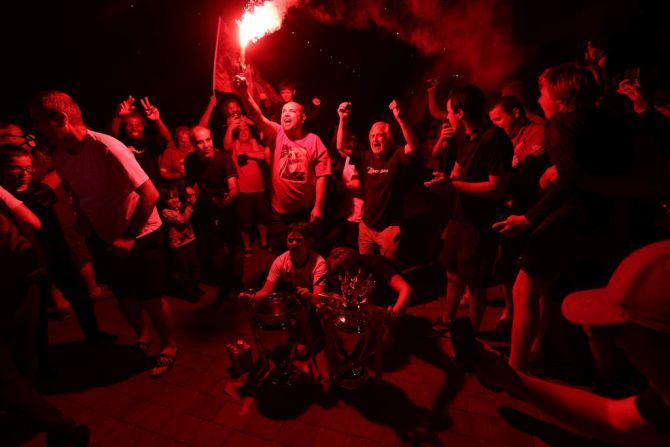Liverpool fans celebrate as their team clinches the Premier League title on June 25, 2020 in Liverpool, England