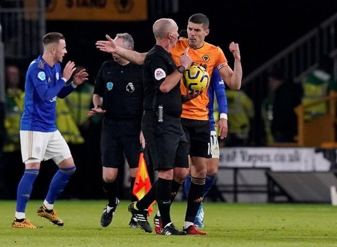 Wolverhampton Wanderers's Conor Coady remonstrates with referee Mike Dean after their goal is disallowed for off-side during their Premier League match.
