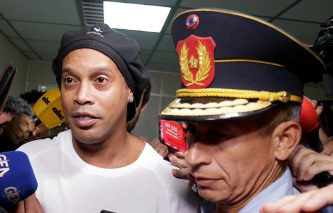 Former Brazil and Barcelona footballer Ronaldinho leaves Paraguay's Supreme Court after testifying in Asuncion, Paraguay, on Friday.