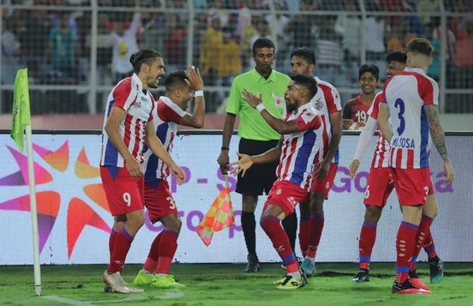 ATK’s players celebrate after David Williams (No. 9) scores their third goal against Bengaluru FC during the ISL second leg semi-final in Kolkata on Sunday