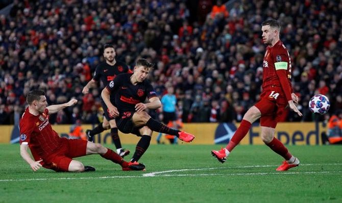 Marcos Llorente scores Atletico Madrid's second goal in the Champions League Round of 16 second leg against Liverpool, at Anfield, Liverpool, on Wednesday