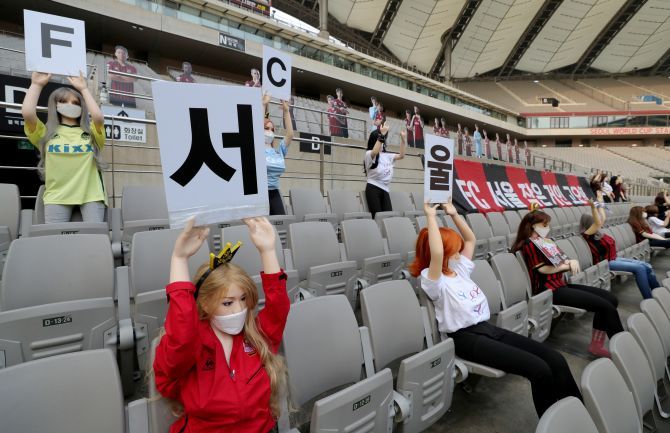 Mannequins are placed in spectator seats to cheer South Korea's football club FC Seoul team during a match against Gwangju FC, which is held without fans due to the coronavirus disease (COVID-19) outbreak, in Seoul, South Korea, on Sunday