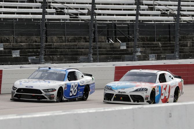 Driver Chase Briscoe (98) leads driver Kyle Busch (54) on the final lap to win the NASCAR Xfinity Series Race at Darlington Raceway in Darlington, SC, USA, on Thursday