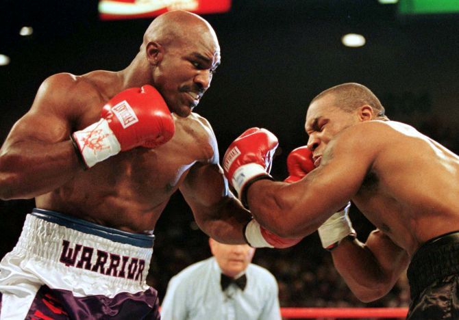 Evander Holyfield lands a punch on Mike Tyson during their second infamous bout on June 28 1997