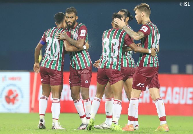 ATK Mohun Bagan players celebrate after defeating Kerala Blasters in the Indian Super League season opener in Bambolim, Goa, on Friday