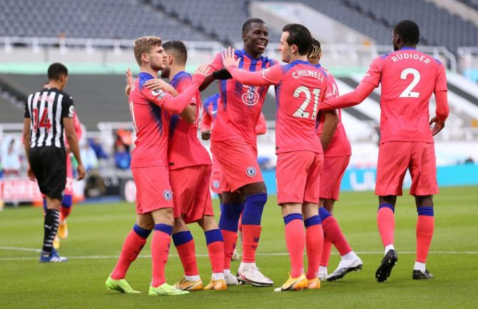 Chelsea's Ben Chilwell, Kurt Zouma, Timo Werner and teammates celebrate after their team's first goal, an own goal scored by Federico Fernandez of Newcastle United during their Premier League match at St. James Park in Newcastle upon Tyne, on Saturday