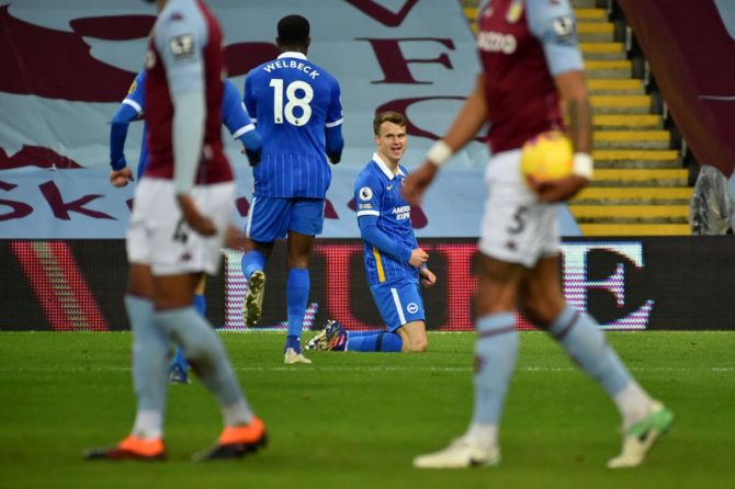 Brighton and Hove Albion's Solly March celebrates after scoring his team's second goal against Aston Villa at Villa Park in Birmingham on Saturday