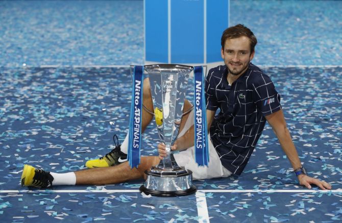 Russia's Daniil Medvedev celebrates with the trophy after defeating Austria's Dominic Thiem to win the ATP Tour Finals title in London on Sunday 