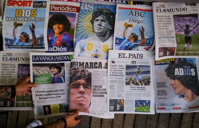 Covers of national newspapers are seen at a newsstand the day after the death of soccer player Diego Armando Maradona in Naples, Italy, on Thursday. 