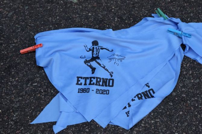 Bandanas with an image of Diego Maradona are sold at Plaza de Mayo during Diego Maradona's funeral in Buenos Aires