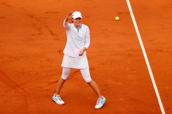 Poland's Iga Swiatek celebrates an easy victory over Argentina's Nadia Podoroska in the women's singles semi-finals of the French Open