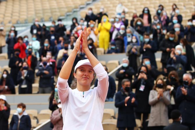 Poland's Iga Swiatek celebrates after winning championship point during the women's singles final against Sofia Kenin of the United States at the French Open on Saturday. 