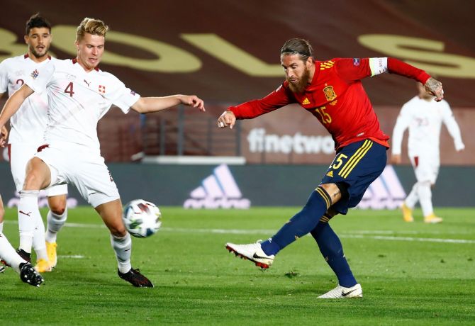 Spain's Sergio Ramos is challenged by Switzerland's Nico Elvedi during the Nations League A Group A match