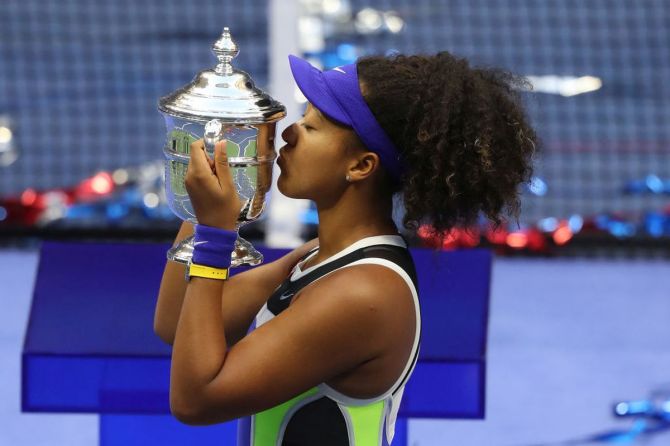 Japan's Naomi Osaka kisses the trophy after winning the US Open title on Saturday