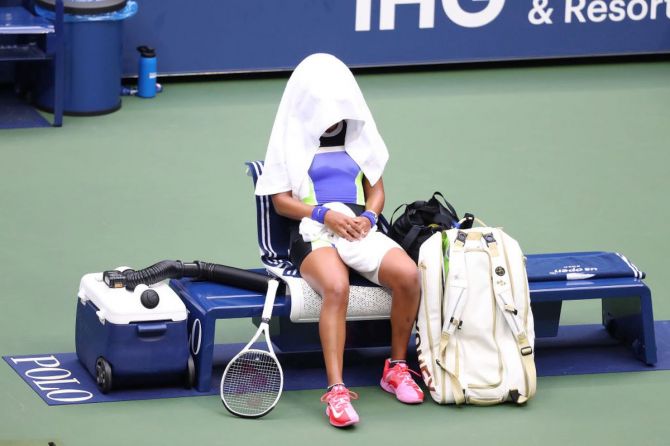 Japan's Naomi Osaka sits on her bench after losing the first set