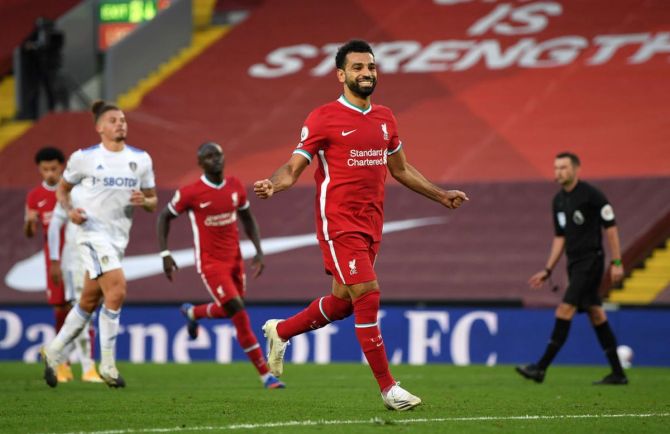 Liverpool's Mohamed Salah celebrates after scoring his team's fourth goal during the Premier League match against Leeds United at Anfield in Liverpool on Saturday 