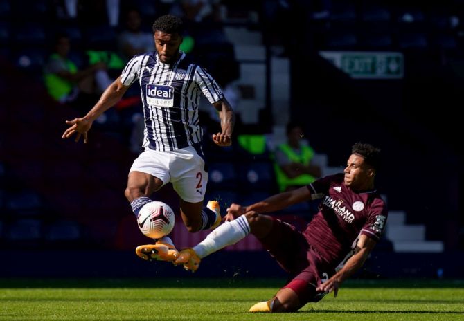 West Bromwich Albion's Darnell Furlong is challenged by Leicester City's James Justin