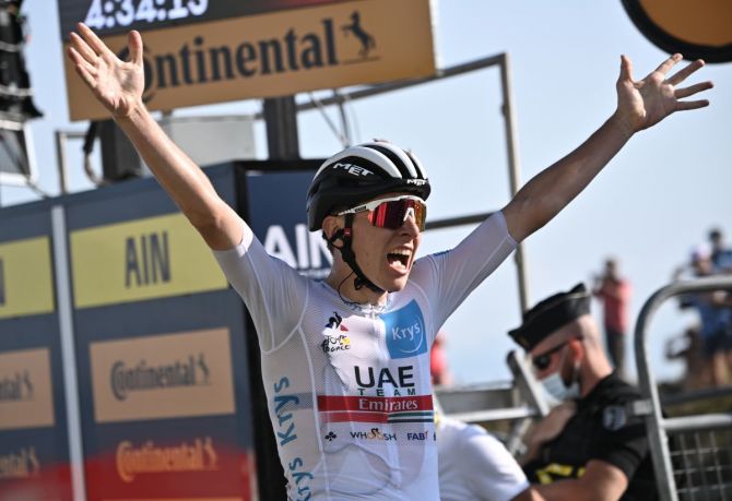 UAE Team Emirates rider Tadej Pogacar of Slovenia, wearing the white jersey for best young rider, crosses the finish line to win the Stage 15, Lyon to Grand Colombier, France, on Sunday