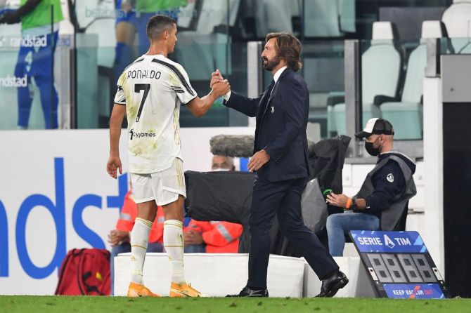 Juventus Cristiano Ronaldo (left) and Juventus head coach Andrea Pirlo celebrate victory at the end of the Serie A match against UC Sampdoria at Allianz Stadium in Turin.