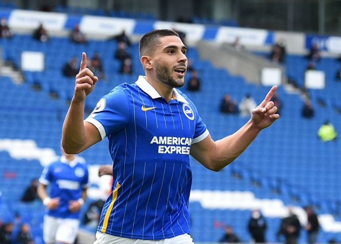 Neal Maupay celebrates scoring from the penalty spot to put Brighton & Hove Albion's ahead in the match. 