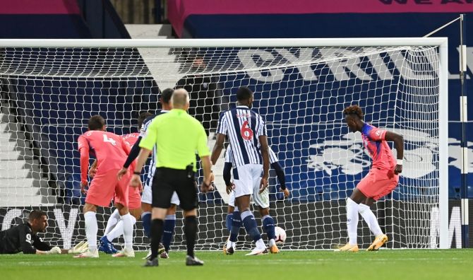 Tammy Abraham, at the far post, scores in the dying minutes of added to earn Chelsea a 3-3 draw against West Bromwich Albion