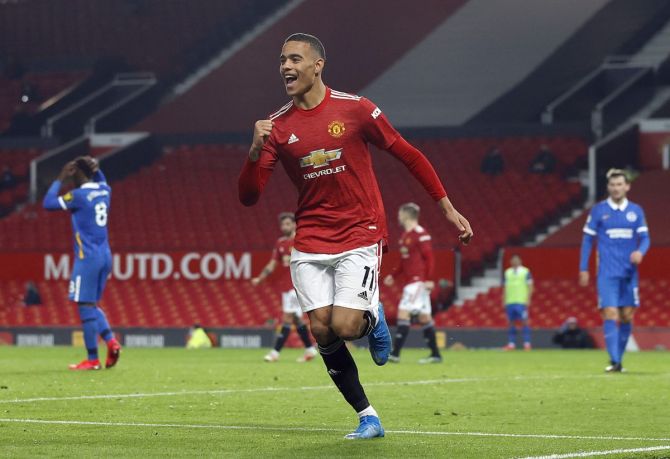 Manchester United's Mason Greenwood celebrates scoring their second goal against Brighton & Hove Albion at Old Trafford 