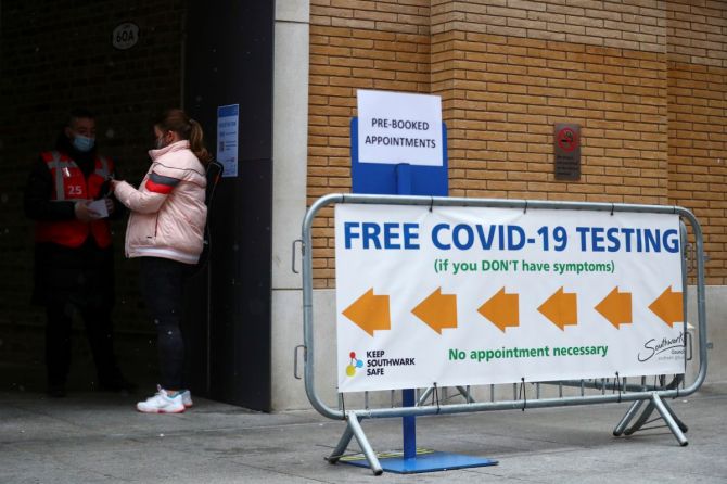 People stand outside a coronavirus disease (COVID-19) test centre at London Bridge Station, in London, Britain, April 5