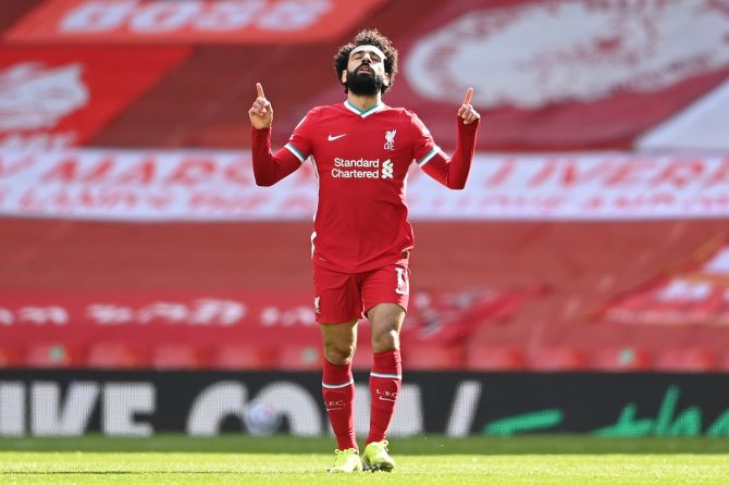 Mohamed Salah celebrates scoring Liverpool's first goal