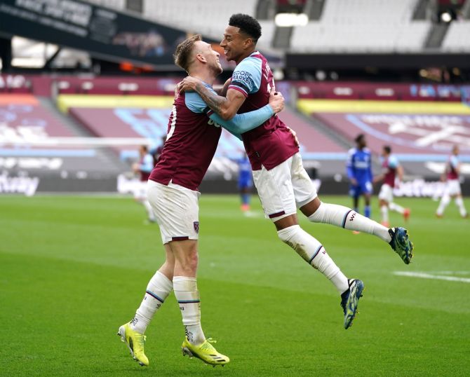 Jesse Lingard celebrates with Jarrod Bowen after scoring West Ham United's second goal. 