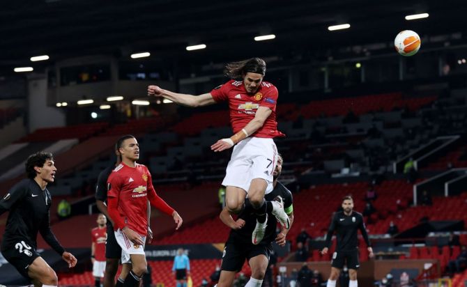 Manchester United's Edinson Cavani heads at goal against Granada at Old Trafford 