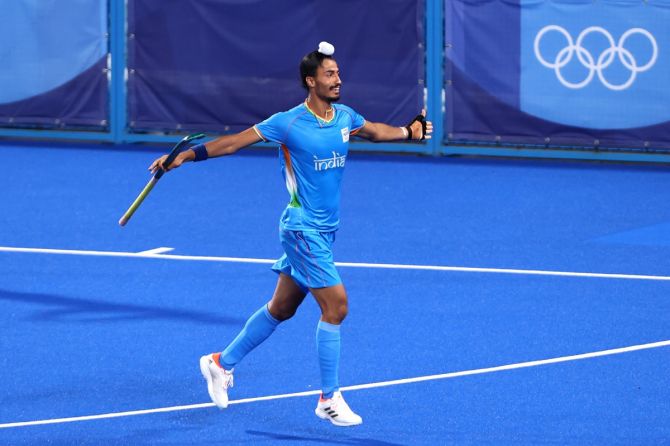 Dilpreet Singh celebrates after scoring India's first goal.