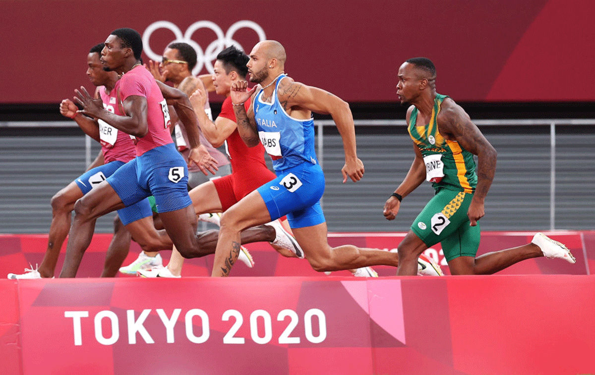 Runners compete in the Men's 100m final at the Tokyo 2020 Olympic Games at Olympic Stadium