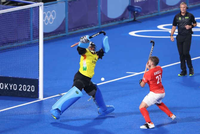India's goalkeeper P R Sreejesh makes a save off Great Britain's Liam Paul.