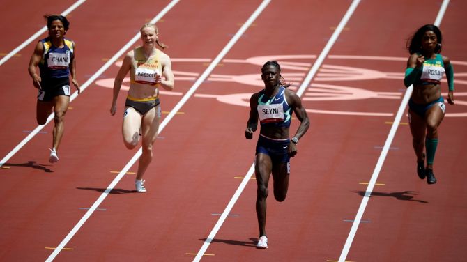 India's Dutee Chand (extreme left), Germany's Jessica-Bianca Wessolly, Niger's Aminatou Seyni and Brazil's Vitoria Cristina Rosa in action during Heat 4 of the Olympics women's 200 metres, at Olympic stadium, in Tokyo, on Monday.