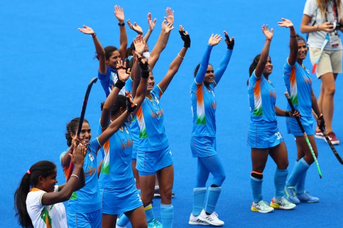 India's players wave to the few spectators in the stands after victory over Australia in the Olympics women's hockey quarter-final on Monday.