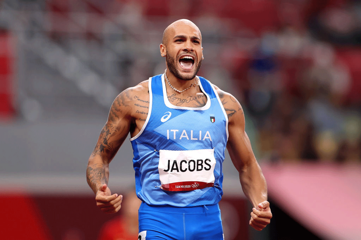 Lamont Marcell Jacobs reacts after winning the men's 100m final on Sunday